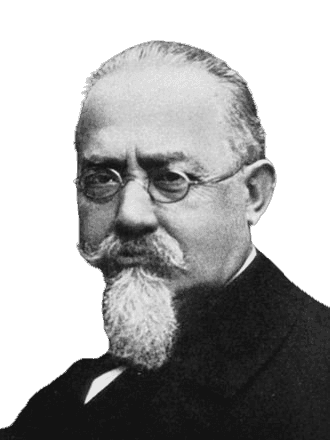 A vintage black-and-white portrait of an elderly man with round glasses, a neatly groomed goatee, and a serious expression. His formal attire and distinctive facial hair convey a scholarly or authoritative presence, suggesting he is a prominent intellectual or scientific figure from the late 19th to early 20th century.