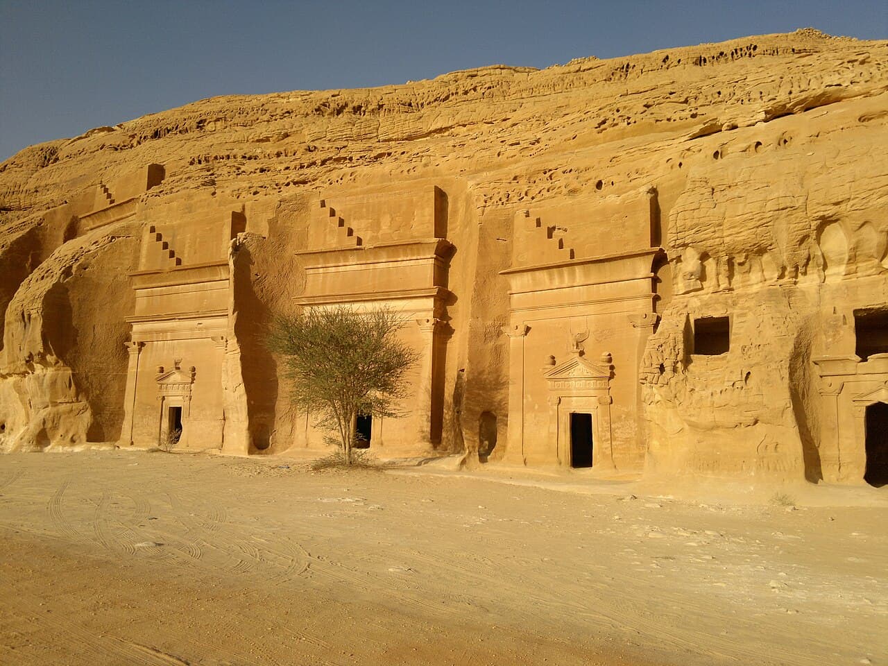 A Nabataean tomb carved into an isolated sandstone outcrop at Hegra